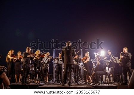 Similar – Foto Bild Eine Geigerin spielt klassische Musik in einem Saal