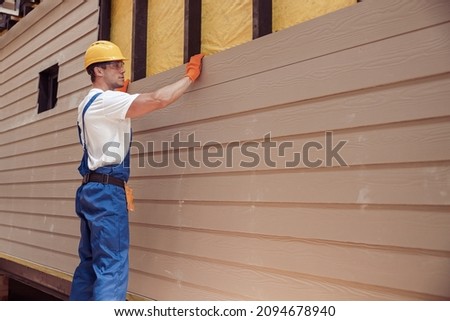 Male worker building house at construction site Foto stock © 
