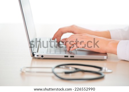 Female doctor with computer