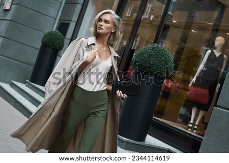 Similar – Image, Stock Photo Stylish woman walking in city