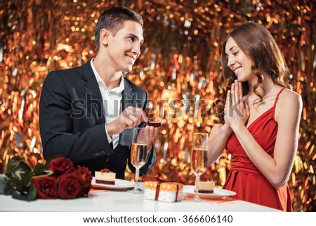 https://image.shutterstock.com/display_pic_with_logo/634813/366606140/stock-photo-romantic-photo-of-beautiful-couple-on-glitter-gold-background-couple-having-dinner-there-are-366606140.jpg