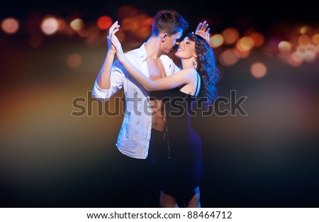 Loving couple dancing in the night city