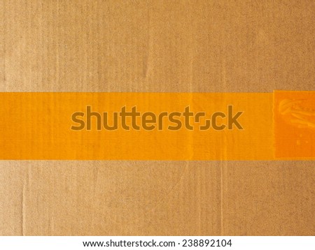 Brown corrugated cardboard parcel useful as a background