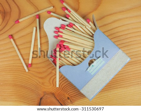 Matches for lighting fire in a matchbox on a wooden table