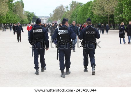PARIS - APRIL 27: French police control the street in Paris, 27 april 2013, France.  Paris is one of the most populated metropolitan areas in Europe
