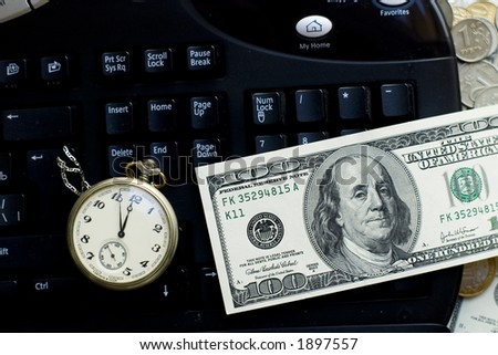 Time is money- clock, keyboard and dollars