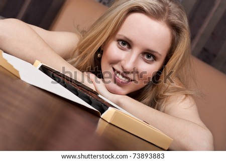 Attractive young lady with a box of candies