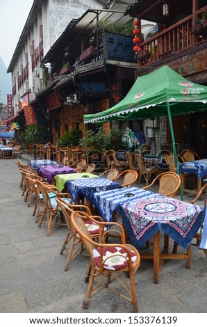 YANGSHUO, CHINA - MARCH 24: Restaurants in West street is ready for tourists to step in on March 24, 2012 in Yangshuo. West Street is the oldest street in Yangshuo with history more than 1400 years.