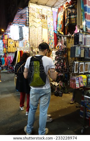 HONG KONG - NOVEMBER 22 :Tourist shops for fashion and casual wear in Mong Kong night market on 22 November 2014. The busy night market is famous with many booths setting up to sell local products.