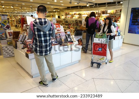 HONG KONG- NOVEMBER 22: Customers shop for books on 23 November 2014 in Hong Kong Airport. Hong Kong airport provides the best shopping experience to the passengers.