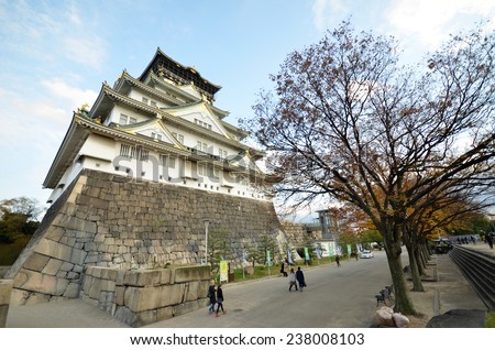 OSAKA, JAPAN- DEC 04: Tourists visit Osaka castle in Osaka city, Japan on December 04, 2014. The castle is one of Japan most famous and it played a major role in the unification of Japan.