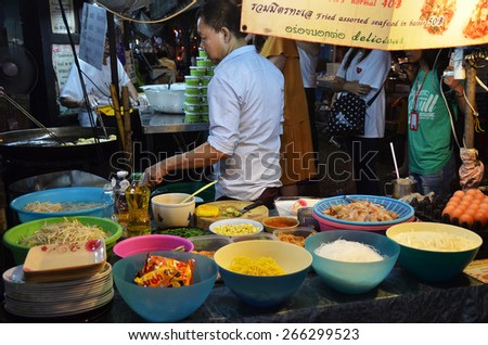 BANGKOK, THAILAND - MAR 27. An unidentified street vendor cooks pad thai on March 27, 2015 in Bangkok, Thailand. Street cooking is a tradition and ubiquitous in Thailand.