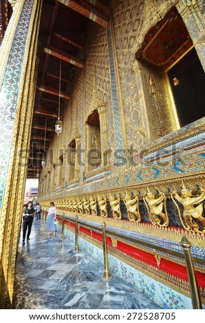 BANGKOK, THAILAND - MAR 26, 2015: Tourists visit the Grand Palace in Bangkok, Thailand on March 26 2015. Grand Palace in Bangkok is the most famous temple and landmark of Thailand.