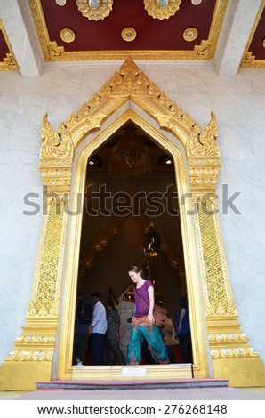 THAILNAD, BANGKOK - MAR 29: People visit Wat Traimit in Bangkok Chinatown on March 29, 2015 in Bangkok, Thailand. The Buddhist temple is one of the most sacred sites in the Thai capital.