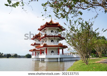 SINGAPORE- JUL 21: Tourists visit the Twin Pagoda at the Chinese Garden of Singapore on July 21, 2015. The Chinese Gardens concept is based on Chinese gardening art.
