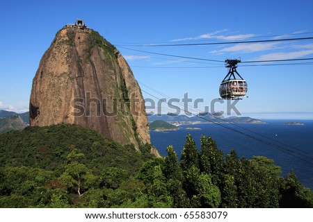 Brazil, Rio de Janeiro, Sugar Loaf Mountain - Pao de Acucar and cable car with the bay and Atlantic Ocean in the background. Rio is one of the venues for the FIFA World Cup 2014.