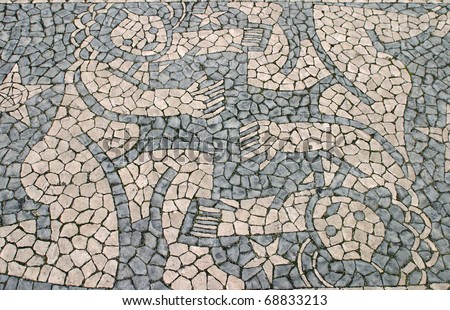 Portugal Lisbon Typical Portuguese black and white mosaic stone pavement \