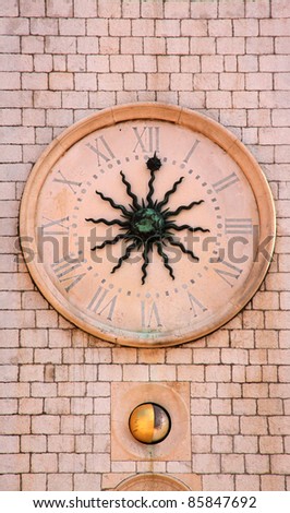 Croatia Dubrovnik UNESCO World Heritage site Late-medievel clock with sun depiction in bronze and Roman numerals