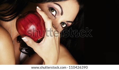 Exotic woman holding red apple