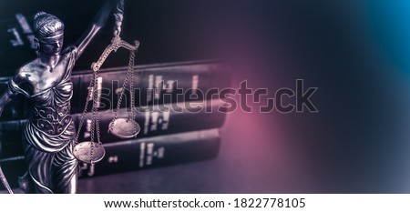 Legal law concept image Scales of Justice and case books on desk.