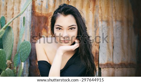 Beautiful face with slight smile young Asian woman