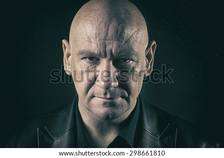 Bald man with serious expression - space stars background