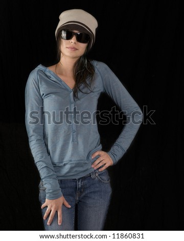 Stylish trendy young woman taking wearing beanie hat