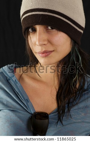 Pretty young teenager wearing beanie hat.