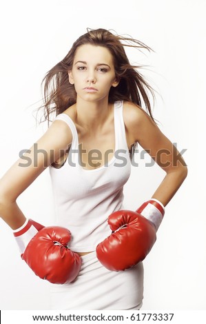 Young attractive woman wearing red boxing gloves isolated against white background