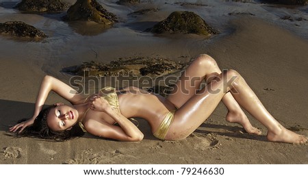 Beautiful woman basking in the sunshine on a beach