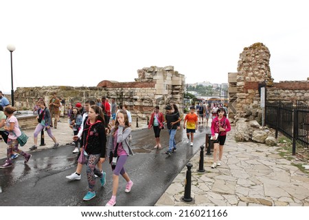 NESSEBAR, BULGARIA - JUNE 18: People visit Old Town on June 18, 2014 in Nessebar, Bulgaria. Nessebar in 1956 was declared as museum city, archaeological and architectural reservation by UNESCO.