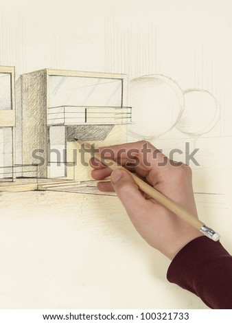 woman\'s hand drawing architectural perspective of modern house