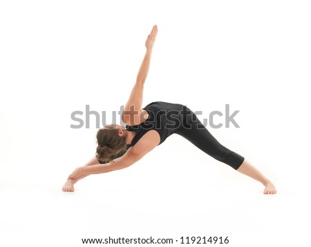 young, blonde woman demonstrating stretching yoga postrure, with face obscured, dressed in blak, on white background