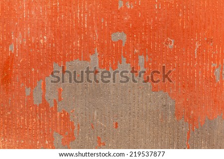 orange textured wall with peeling damaged several scratches