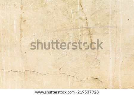 beige textured wall with peeling damaged more scratch