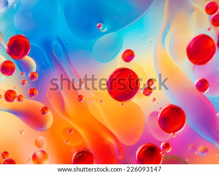 abstract colorful backdrop with oil drops and waves on water surface