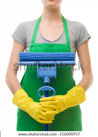 close-up of cleaning lady holding mop in front of her, on white background