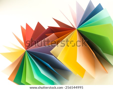 two colorful paper cylinder fan shape on white background