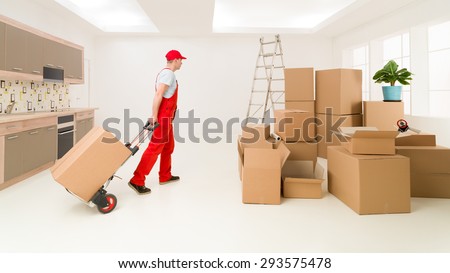 caucasian deliveryman in red uniform holding hand truck, delivering boxes to new house