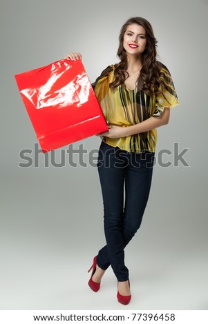 tall brunette woman shopping red bag arms