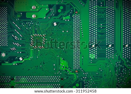 Green circuit board. Background of computer motherboard