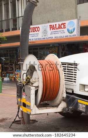 LIMA, PERU - FEBRUARY 11, 2012: Cleaning the sewage with the help of a truck on February 11, 2012 in Miraflores, Lima, Peru
