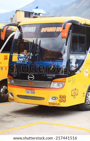 BANOS, ECUADOR - FEBRUARY 22, 2014: Unidentified people in a bus of the Expreso Banos transportation company in the bus terminal on February 22, 2014 in Banos, Ecuador.