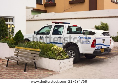 QUITO, ECUADOR - AUGUST 6, 2014: Police car parking at the building of UPC (Unidad de Policia Comunitaria, Communitary Police Unit) on Gil. Ramirez Davalos Street on August 6, 2014 in Quito, Ecuador