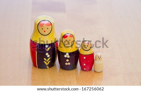 russian dolls on wooden table