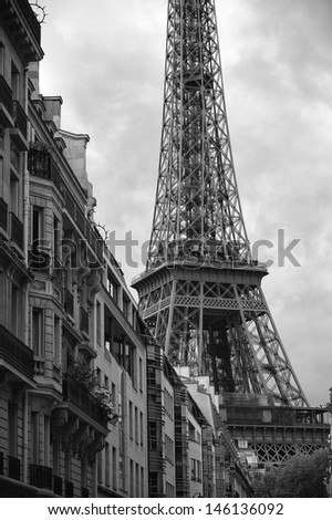 Black and white view of Eiffel Tower with French architecture in Paris France