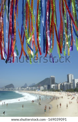 Rio Carnival celebration features colorful Brazilian lembranca wish ribbons at Copacabana Beach