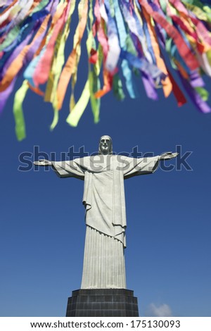 Rio Carnival celebration features colorful Brazilian wish ribbons at statue of Corcovado