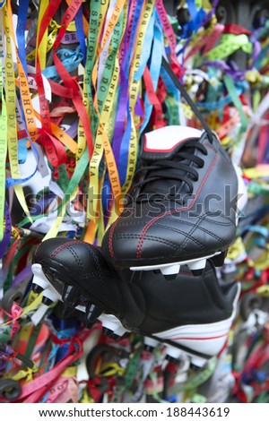 Good luck football boots soccer cleats hanging with Brazilian wish ribbons in Salvador Bahia Brazil