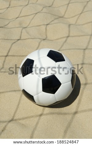 Soccer goal ball in abstract shadow of football net on the beach in Rio de Janeiro Brazil